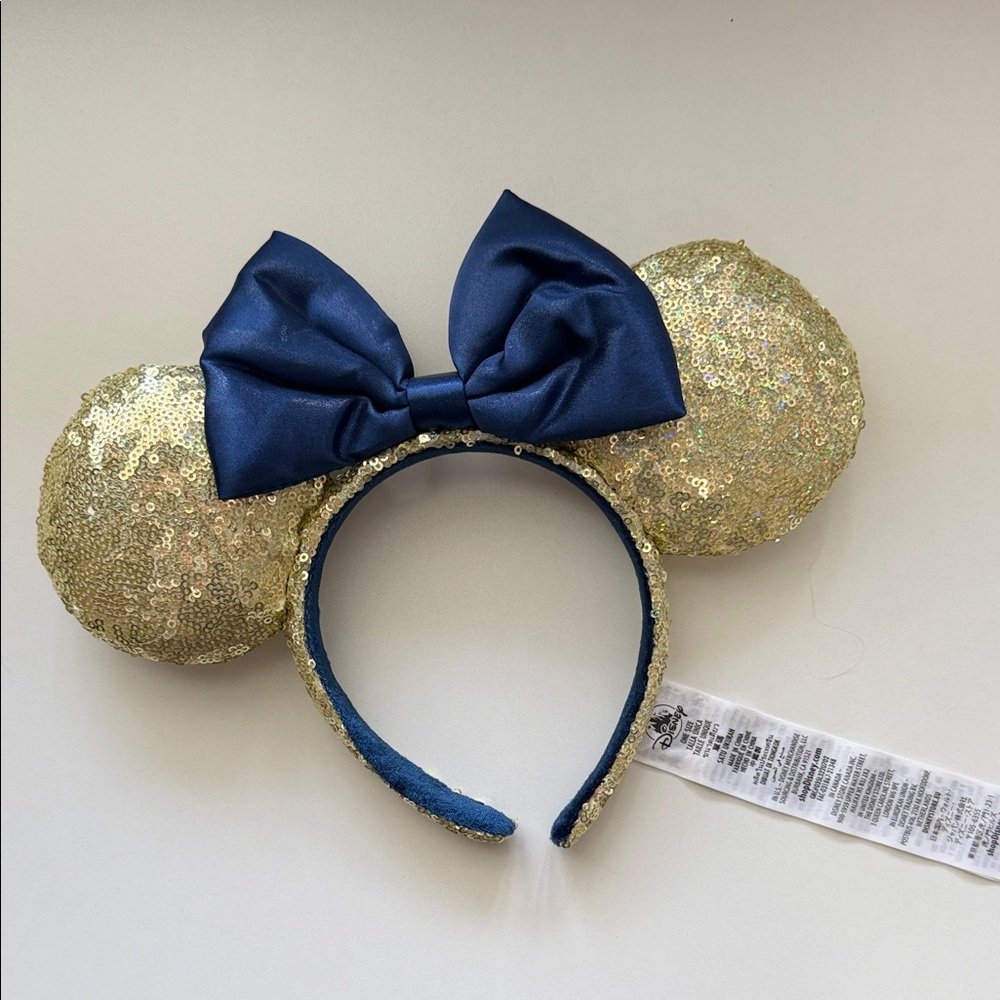 Disney Gold Sequin Minnie Ears Headband with Navy Blue Bow